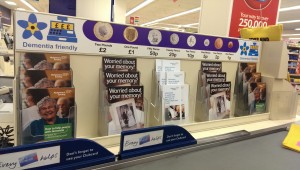 The check-out after its Dementia Friendly makeover, complete with coin reminders